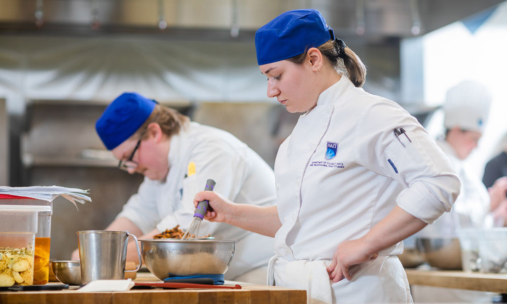 nait students in cooking lab