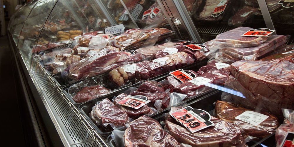 packaged meat in a butcher's case