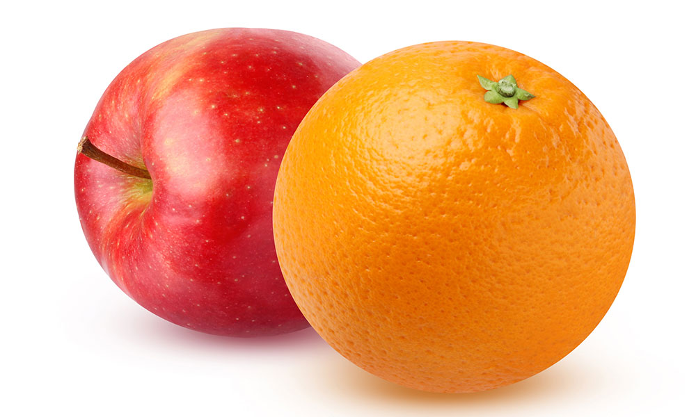 apple and orange sitting side by side