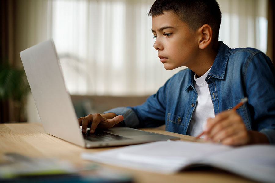 boy attending school online