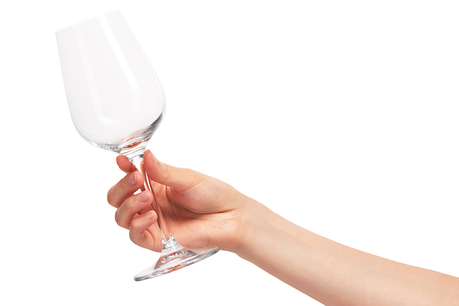 hand holding clean wine glass