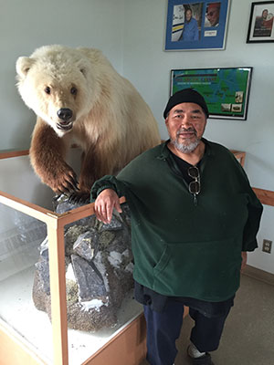 E;der David Kuptana was born and raised in Ulukhaktok; he's pictured here with a grolar he shot