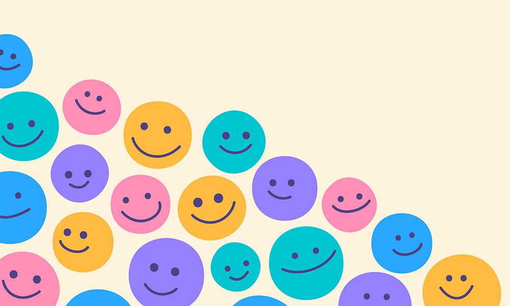 multi-coloured happy faces on beige background