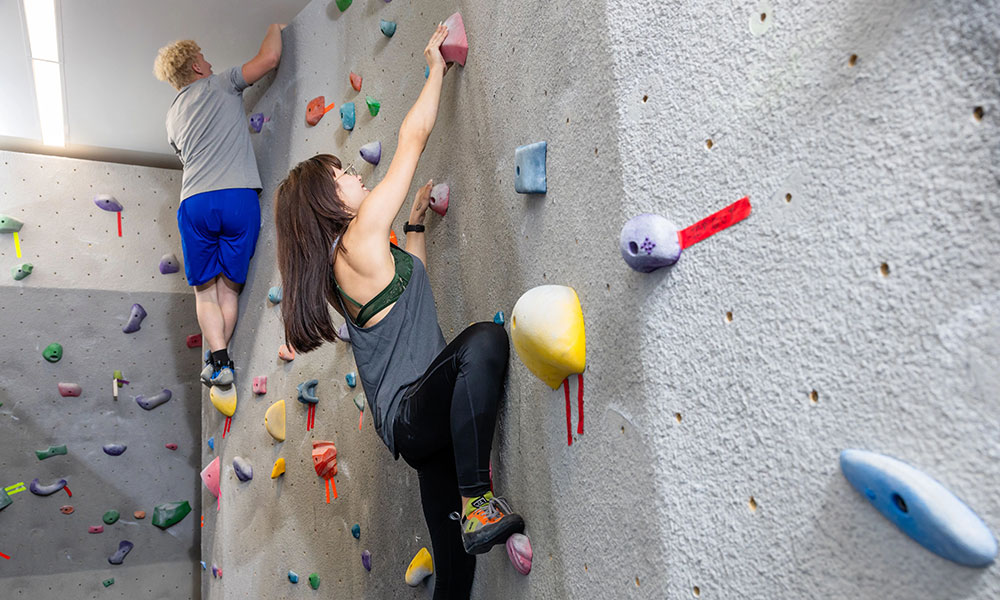 climbers on a wall at the nait fitness centre