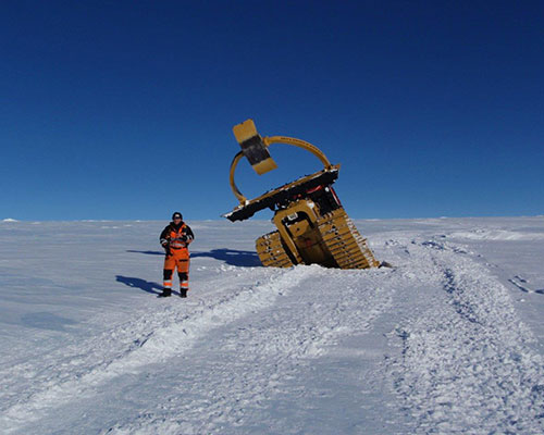 A bulldozer stuck in a crevasse in Antarctica