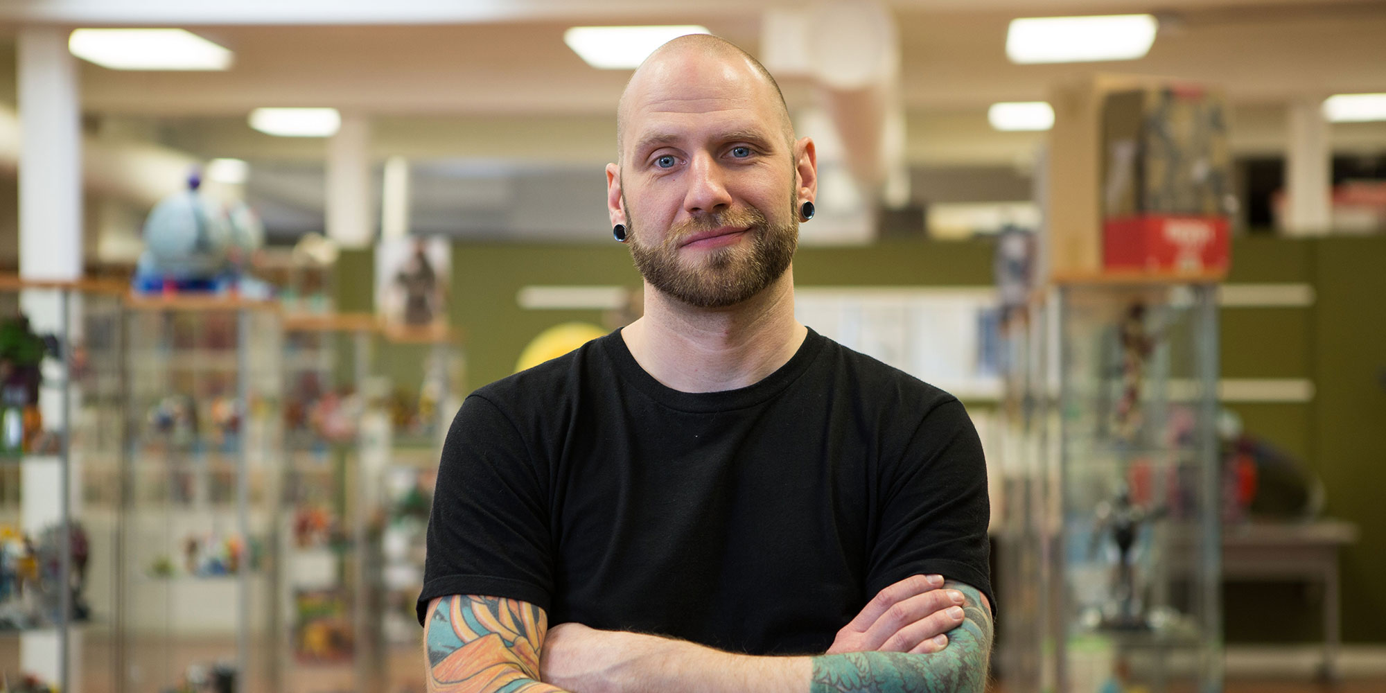 Shane Turgeon, NAIT alum and owner of Shades of Grey tattoo and vintage toy shop