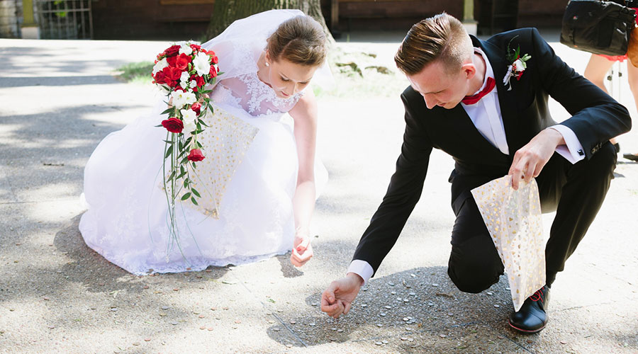 wedding budget, couple picks up coins