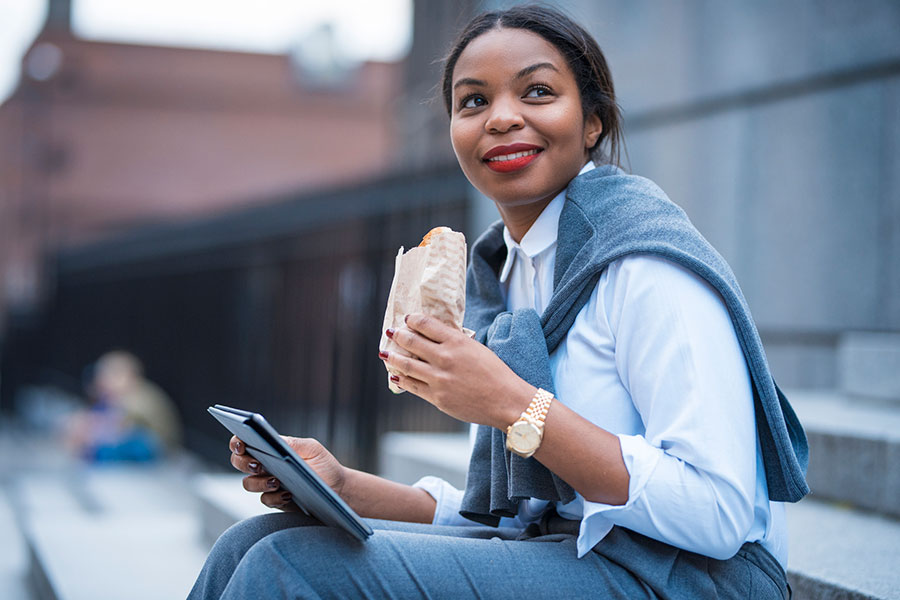 woman eating lunch outdoors