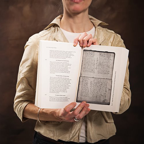 Kristine Kowalchuk holds the book Preserving on Paper